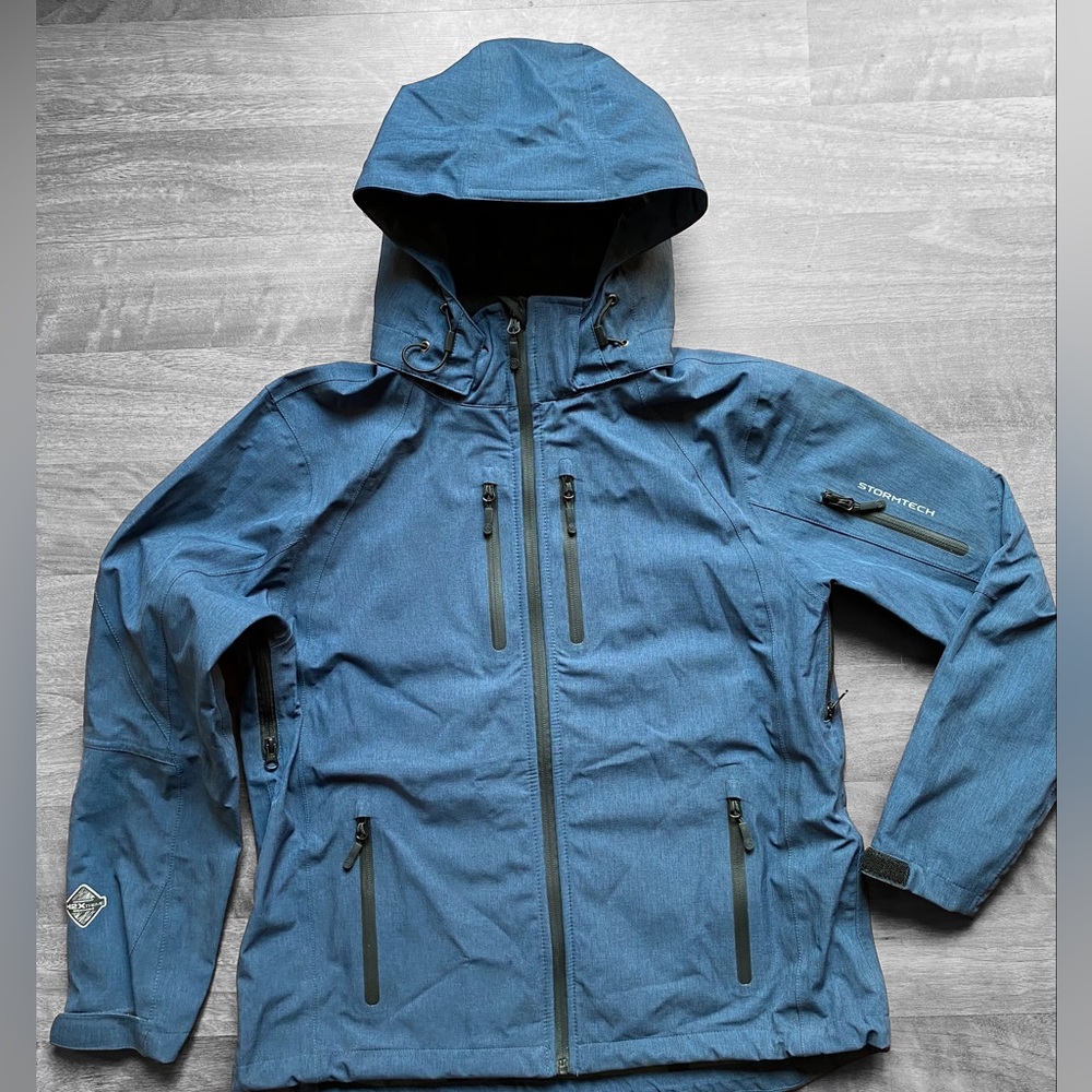 NWOT Stormtech rain jacket. Size Large